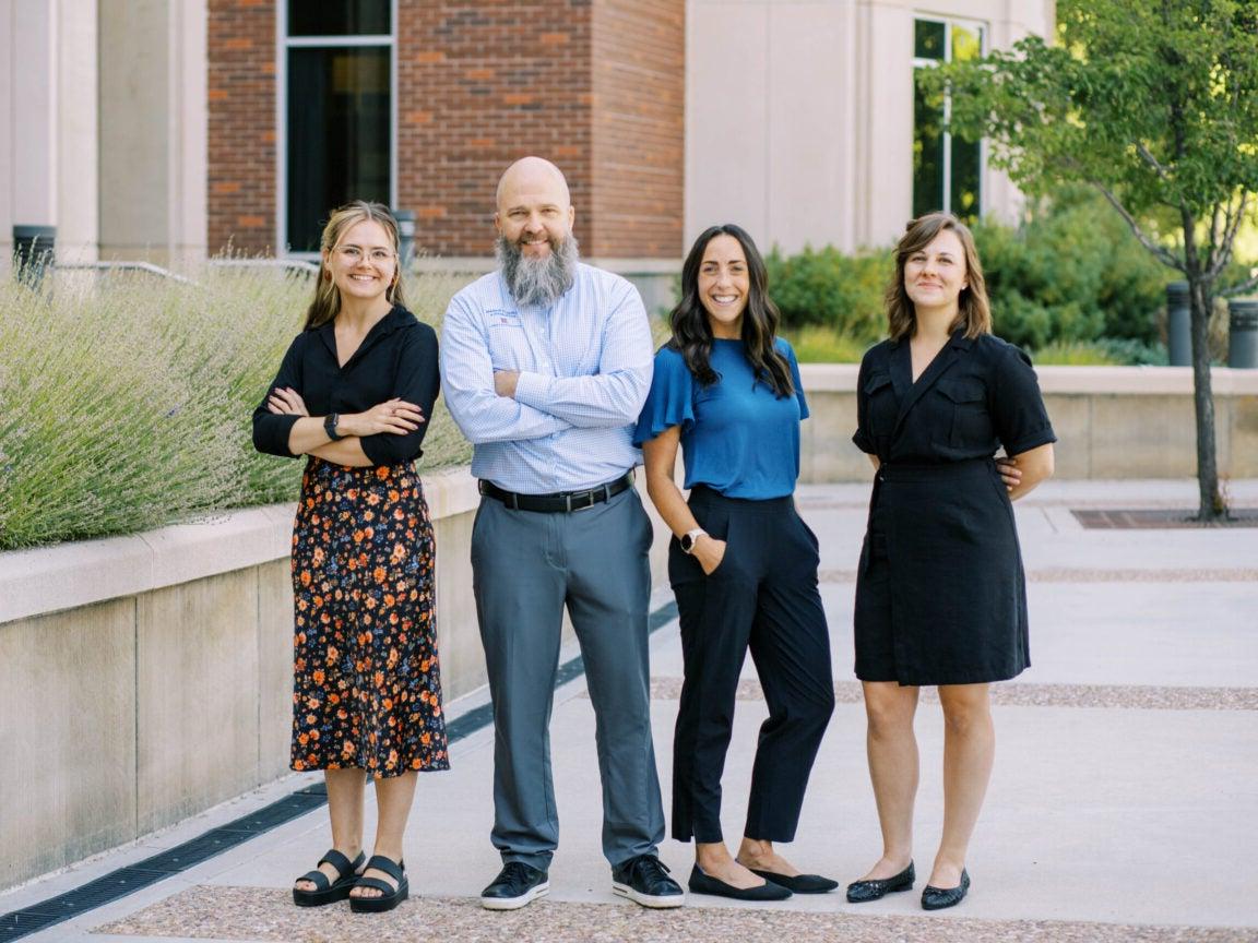 COBE Career Services team standing in front of the business building